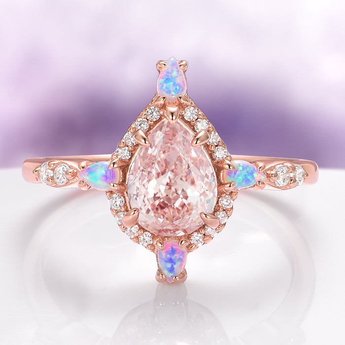 Teardrop Morganite & Fire Opal Engagement Ring in 14K Solid Rose Gold by Aquamarise Gold featuring a pear-shaped morganite center with fire opal and diamond accents on an elegant band.