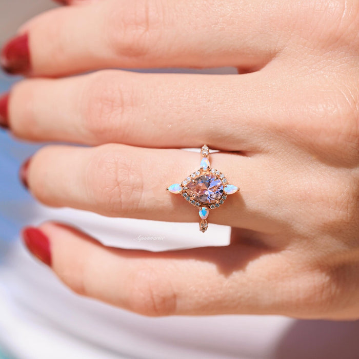Teardrop Morganite & Fire Opal Engagement Ring in 14K Solid Rose Gold by Aquamarise Gold featuring a pear-cut morganite with fire opal accents on a romantic rose gold band.