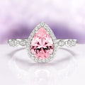 Teardrop Pink Sapphire Ring in Sterling Silver by Aquamarise featuring a vintage-inspired pear-shaped pink sapphire center surrounded by a halo of sparkling stones on a polished silver band, part of Sterling Silver Rings and September Birthstone Jewelry collections.