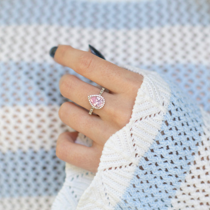 Teardrop Pink Sapphire Ring in Sterling Silver by Aquamarise, featuring a vintage-inspired pear-shaped pink sapphire surrounded by sparkling stones on a polished silver band, part of Sterling Silver Rings and September Birthstone Jewelry collections.