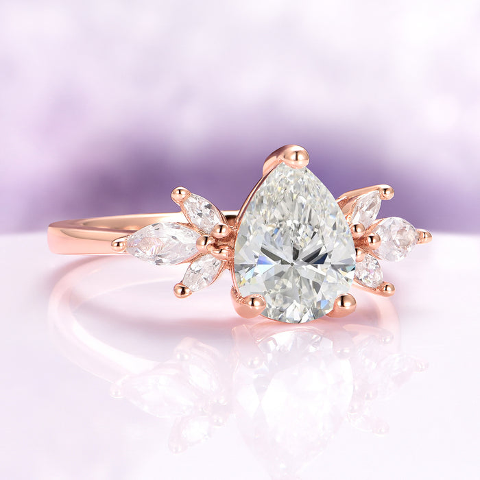 Teardrop White Sapphire Ring in 14K Rose Gold Vermeil by Aquamarise, featuring a 2-carat pear-cut lab-grown white sapphire center stone accented with marquise-cut simulated diamonds in a delicate floral-inspired setting, part of Rose Gold Vermeil Rings, September Birthstone Jewelry, and Engagement Rings for Women collections.