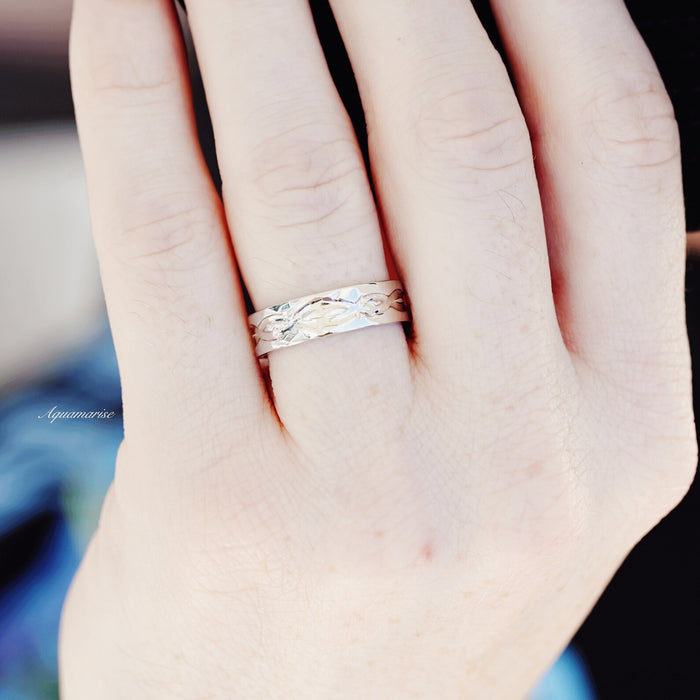 Leaf Motif Wedding Band in Sterling Silver (6mm) on hand, featuring a sleek band with intricate leaf details, crafted by Aquamarise for modern, nature-inspired elegance.