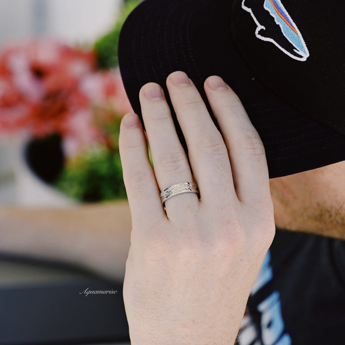 Leaf Motif Wedding Band in Sterling Silver (6mm) worn on hand, showcasing Aquamarise’s sleek design with intricate leaf details, part of Sterling Silver Rings and Men’s Wedding Bands collections.