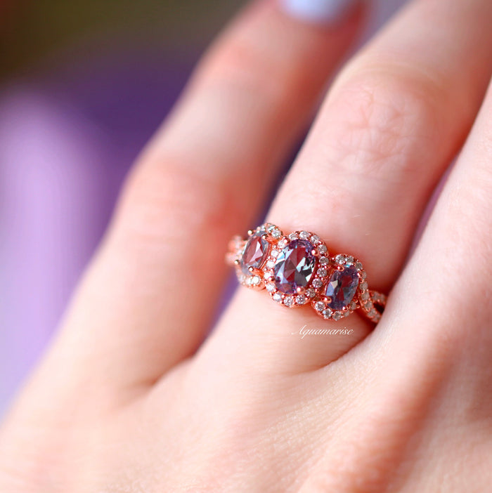 Three Stone Alexandrite Ring in 14K Rose Gold Vermeil by Aquamarise featuring oval lab-grown alexandrite gemstones with sparkling diamond halos on an intricately detailed rose gold vermeil band.