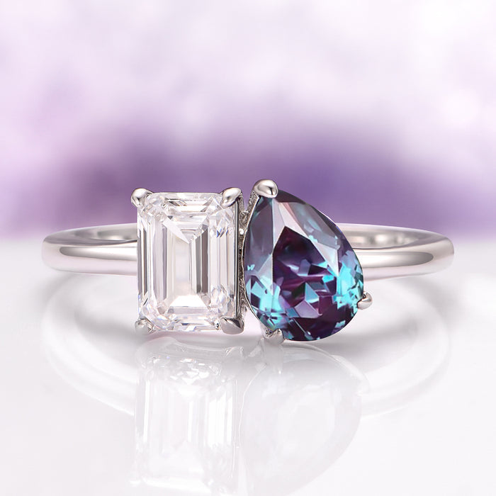Toi Et Moi Alexandrite & Moissanite Engagement Ring in 14K White Gold by Aquamarise Gold showcases a stunning pair of pear-shaped lab-grown alexandrite and emerald-cut moissanite stones on a sleek white gold band, part of Solid Gold Engagement Rings and June Birthstone Jewelry collections.