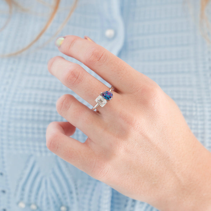 Toi Et Moi Alexandrite & Moissanite Engagement Ring in 14K White Gold by Aquamarise Gold features a pear-shaped lab-grown alexandrite and emerald-cut moissanite stones on a white gold band, part of Solid Gold Engagement Rings and June Birthstone Jewelry collections.