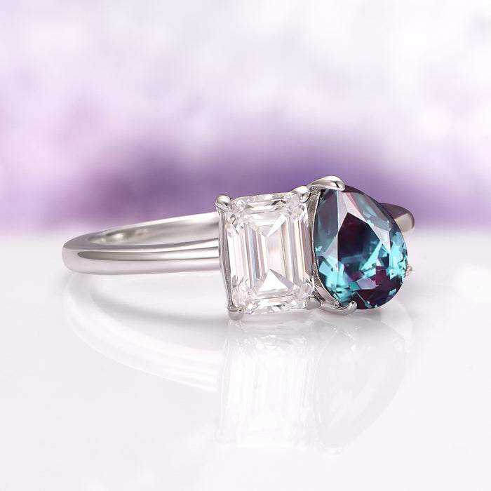 Toi Et Moi Alexandrite & Moissanite Engagement Ring in 14K White Gold by Aquamarise Gold showcases a pear-shaped lab-grown alexandrite and emerald-cut moissanite on a sleek white gold band, part of Solid Gold Engagement Rings and June Birthstone Jewelry collections.