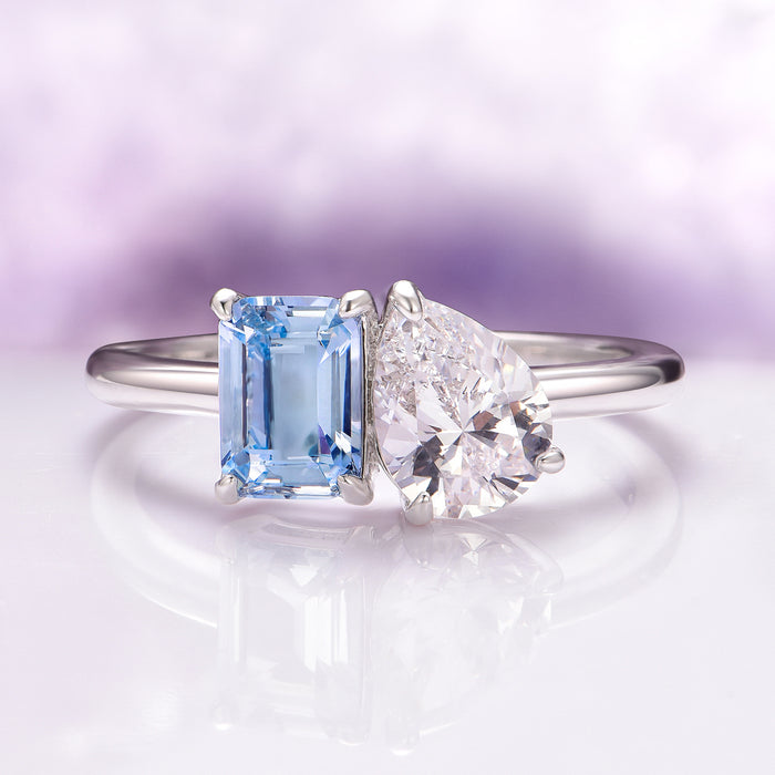Toi Et Moi Lab-Grown Diamond and Aquamarine Ring- 14K White Gold (IGI Certified) by Aquamarise Gold features a delicate white gold band with a pear-shaped lab-grown diamond and an emerald-cut aquamarine, symbolizing a romantic union.