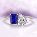 Toi Et Moi Blue Sapphire and Lab-Grown Diamond Engagement Ring in 14K White Gold (IGI Certified) by Aquamarise Gold featuring a striking emerald-cut blue sapphire paired with a pear-shaped lab-grown diamond on a polished white gold band, part of Solid Gold Engagement Rings and Birthstone Jewelry collections.