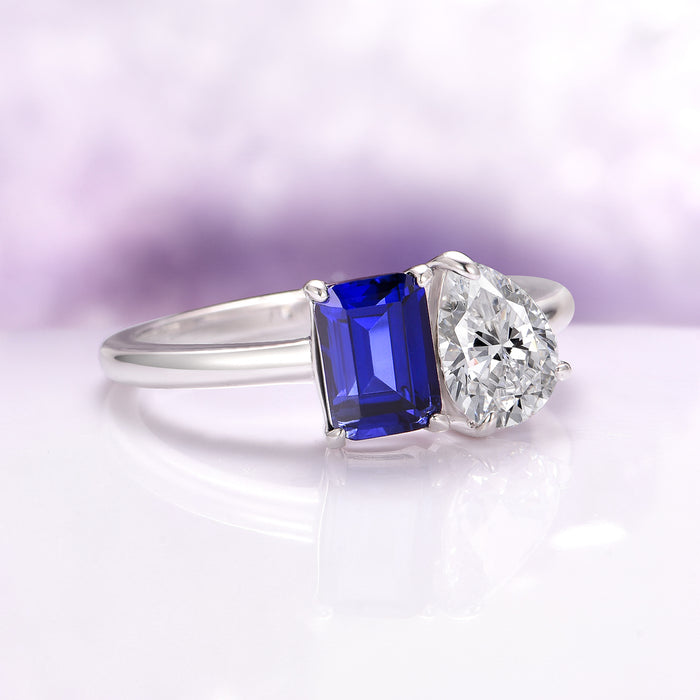 Toi Et Moi Blue Sapphire and Lab-Grown Diamond Engagement Ring in 14K White Gold (IGI Certified) by Aquamarise Gold featuring a striking emerald-cut deep blue sapphire alongside a pear-shaped lab-grown diamond set on a sleek white gold band, part of Solid Gold Engagement Rings and Birthstone Jewelry collections.