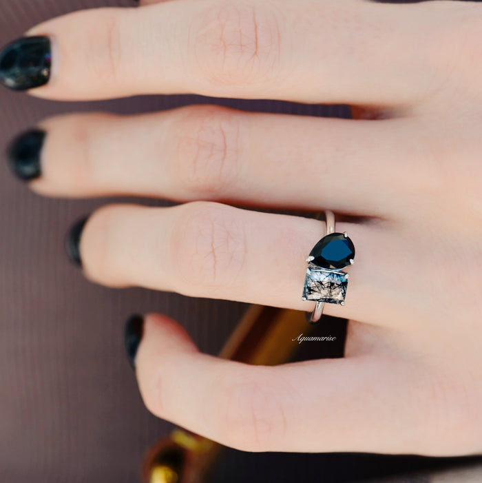 Toi Et Moi Rutilated Quartz & Black Onyx Ring- 14K White Gold by Aquamarise Gold, featuring pear-shaped black onyx and rectangular rutilated quartz on a sleek white gold band.