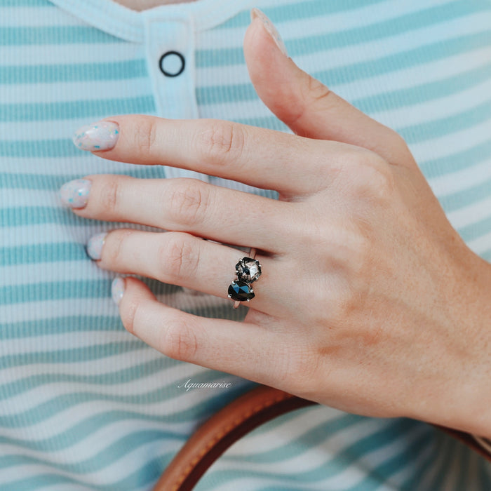 Toi Et Moi Herkimer Diamond & Black Onyx Ring- 14K White Gold by Aquamarise Gold, featuring contrasting gemstones on a white gold band worn on a hand with a striped top background.