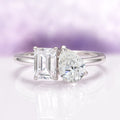 Toi Et Moi Lab-Grown Diamond Engagement Ring in 14K White Gold (IGI Certified) by Aquamarise Gold features a modern design with two IGI-certified lab-grown diamonds, including an emerald cut and a pear-shaped stone, set on a sleek white gold band.