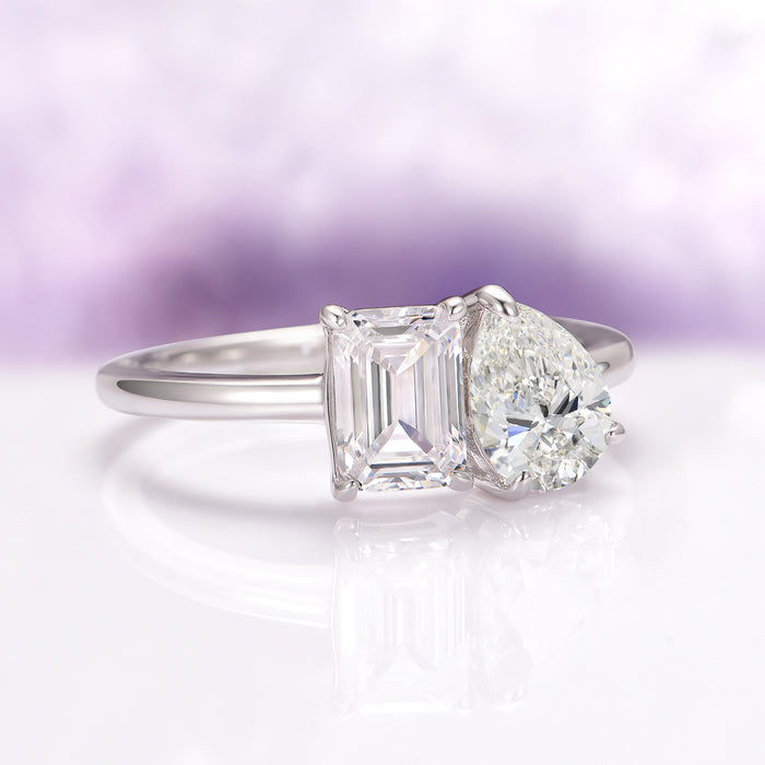 Toi Et Moi Lab-Grown Diamond Engagement Ring in 14K White Gold (IGI Certified) by Aquamarise Gold features a romantic design with an emerald-cut and pear-shaped lab-grown diamonds set on a polished white gold band, part of Solid Gold Engagement Rings and April Birthstone Jewelry collections.