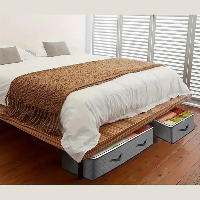 under-bed storage bags for bedding storing quilts and blankets under a wooden bed frame