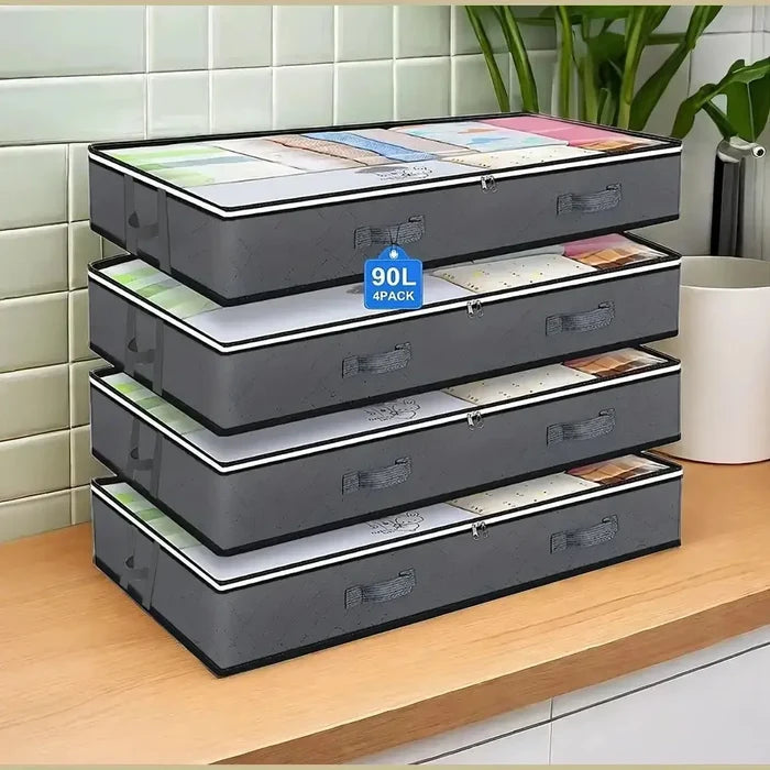 Under-bed storage bags for bedding stacked on a kitchen counter, 4 pack design perfect for quilts and seasonal clothing.