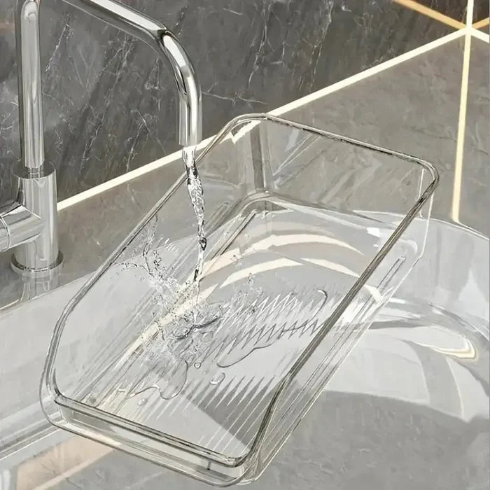 under-sink bathroom organizer with water flowing into a clear container