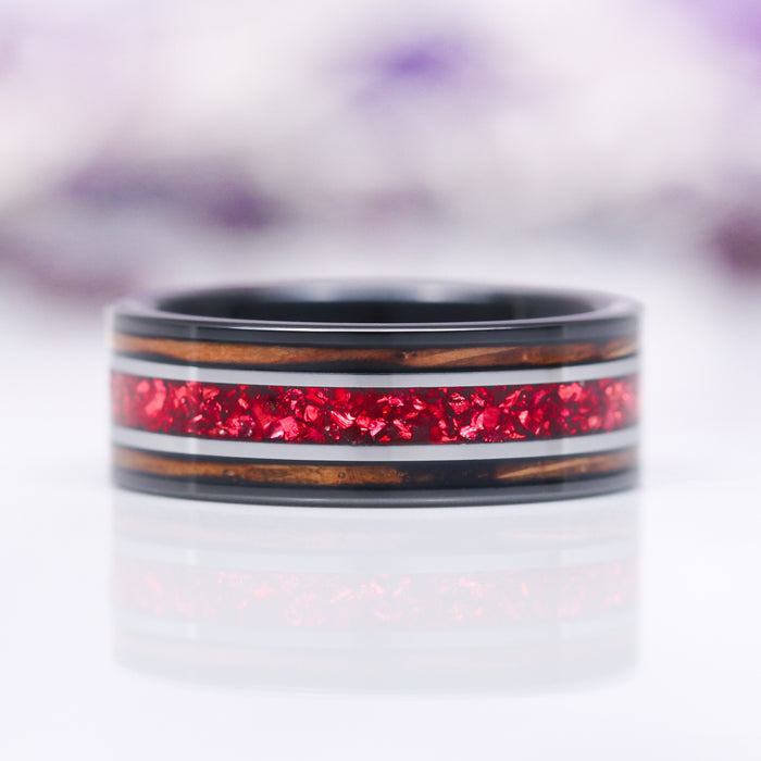 Unique Fireworks Cut Garnet & Whiskey Barrel Couples Ring Set by Aquamarise featuring a bold ring with sparkling red garnet inlay framed by warm whiskey barrel wood accents and black finish, part of Matching Couples' Rings and Best Selling Jewelry collections.