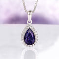 Vera Starry Night Necklace in Sterling Silver by Aquamarise featuring a pear-shaped dark blue sandstone teardrop surrounded by sparkling crystals, inspired by celestial Night Court jewelry collections.