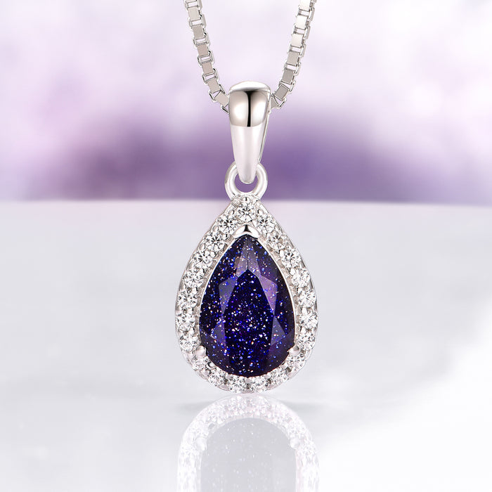 Vera Starry Night Necklace in Sterling Silver by Aquamarise featuring a pear-shaped dark blue sandstone teardrop surrounded by sparkling crystals, inspired by celestial Night Court jewelry collections.
