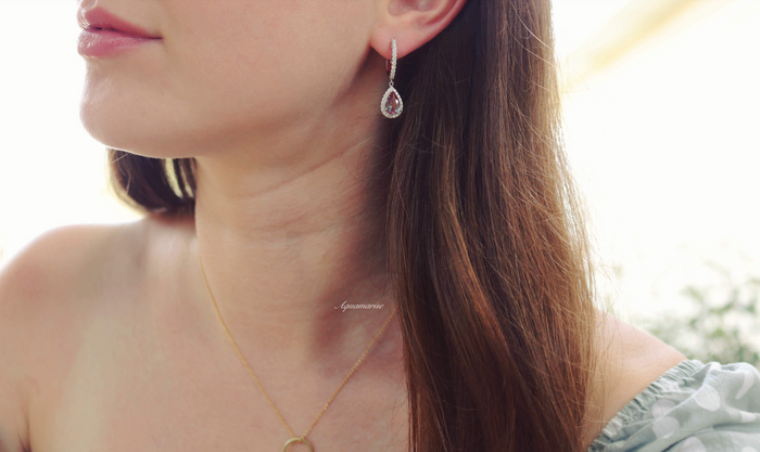 Vera Teardrop Lab-Grown Alexandrite Drop Earrings in Sterling Silver worn by a woman, featuring delicate teardrop-shaped lab-grown alexandrite gemstones by Aquamarise.