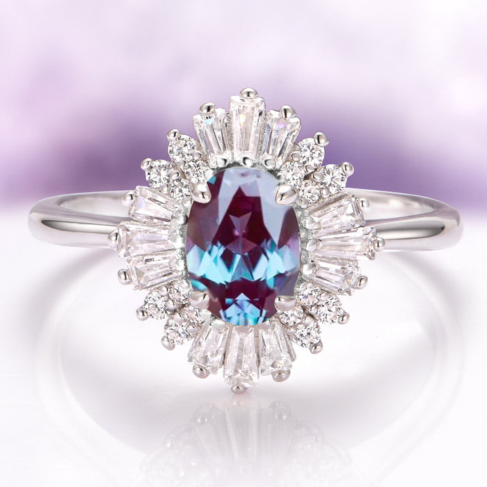 Victoria Art Deco Alexandrite Engagement Ring in 14K White Gold by Aquamarise Gold featuring an oval alexandrite framed by radiant moissanite accents in a vintage-inspired design.