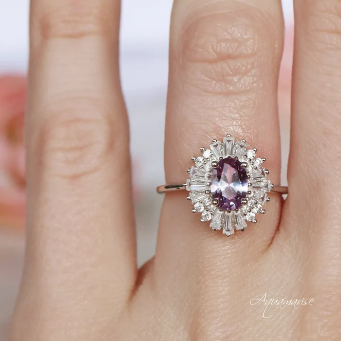 Victoria Art Deco Alexandrite Engagement Ring in 14K White Gold by Aquamarise Gold, featuring an oval alexandrite surrounded by radiant moissanite accents in a vintage-inspired design.