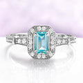Vintage Halo Aquamarine Ring in Sterling Silver by Aquamarise, featuring a vintage-inspired emerald-cut aquamarine surrounded by a milgrain-edged halo with pavé-set shoulders.