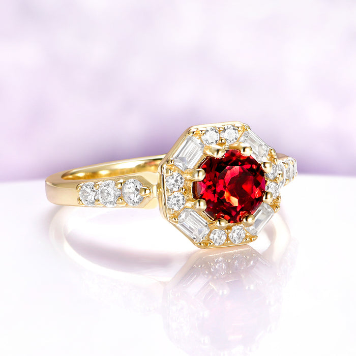 Vintage Hexagon Halo round Garnet Ring in 14K Yellow Gold Vermeil by Aquamarise, featuring a 0.85 carat red garnet center with baguette and round simulated diamond accents.
