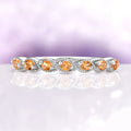 Vintage Natural Citrine Band in Sterling Silver by Aquamarise features a delicate vintage-inspired design with round natural citrine gemstones set in a sterling silver band adorned with intricate milgrain details, ideal for birthstone jewelry and anniversary gifts.