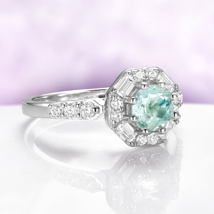 Vintage Octagon Halo Green Amethyst Ring in Sterling Silver by Aquamarise, featuring a 0.85 carat green amethyst with baguette and round simulated diamond halo on a rhodium-finished band.