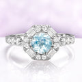 Vintage Octagon Halo Round Aquamarine Ring in Sterling Silver by Aquamarise, featuring a 0.85 carat aquamarine center with baguette and round simulated diamonds in a vintage halo design.