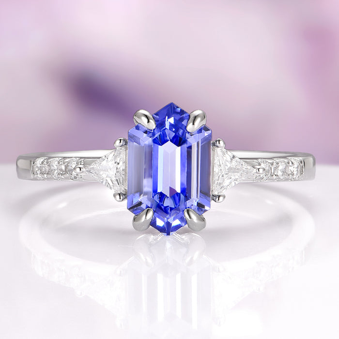 Violet Hexagon Lab Sapphire Ring in Sterling Silver by Aquamarise, showcasing a vibrant hexagon-cut violet lab sapphire center stone set in a slim sterling silver band accented with delicate simulated diamonds, part of Sterling Silver Rings and September Birthstone Jewelry collections.
