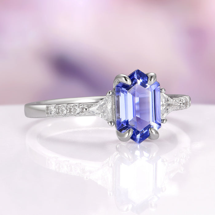 Violet Hexagon Lab Sapphire Ring in Sterling Silver by Aquamarise, featuring a hexagon-cut violet lab sapphire center stone in a polished sterling silver band accented with sparkling simulated diamonds, part of Sterling Silver Rings and September Birthstone Jewelry collections.