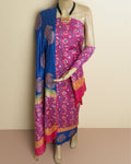 Violet Katan silk unstitched suit set printed in dense fuchsia and blue paisley with small floral sprigs and wide horizontal bands at the dupatta edges