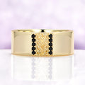 Mens 8mm yellow gold vermeil wedding band with a carved leaf panel and black onyx channels
