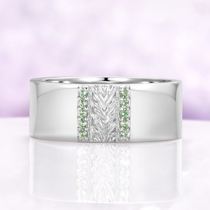 Mens 8mm sterling silver wedding band with a carved leaf panel and green tourmaline channels