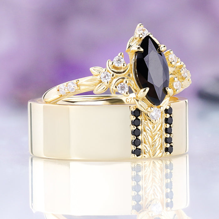 Angled view of the Viridian black onyx ring resting on the matching men's gold vermeil band, sold together as a couples set