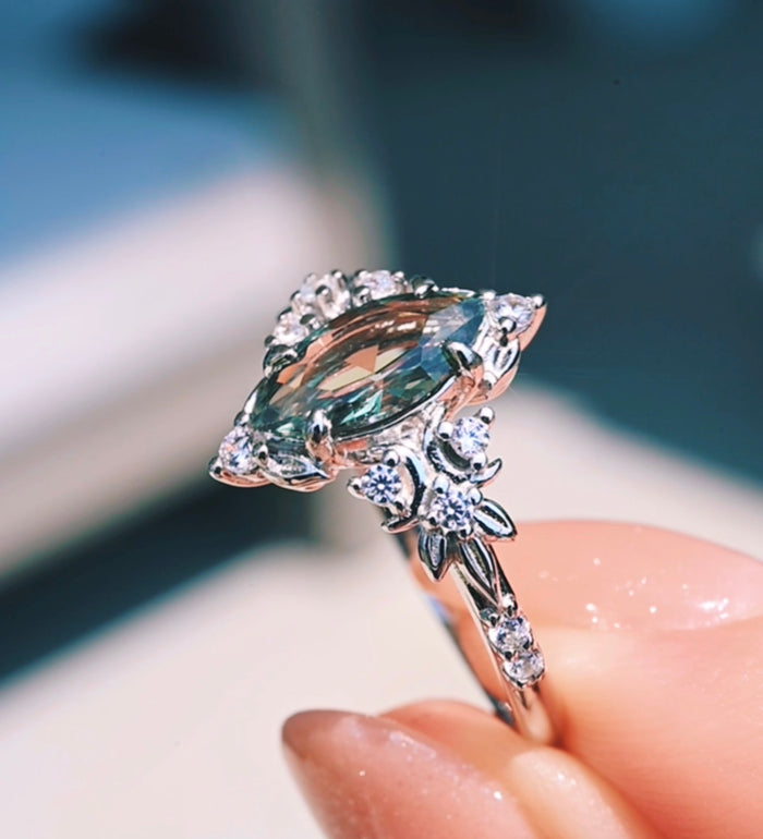 Viridian Marquise Green Tourmaline Engagement Ring in Sterling Silver by Aquamarise, held in hand to show the marquise green tourmaline centre.