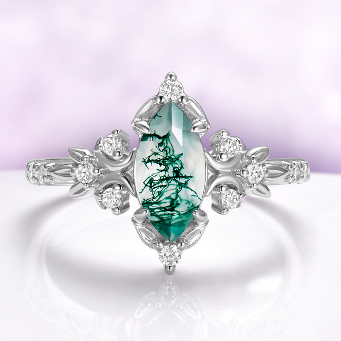 Marquise moss agate engagement ring in sterling silver with crescent moons and leaf shoulders