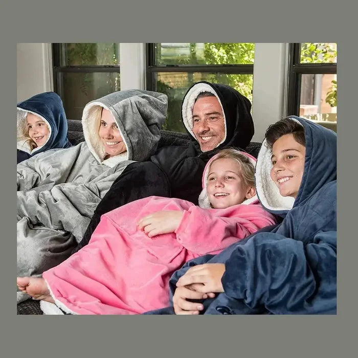 Family enjoying warmth and comfort in wearable blanket hoodies.