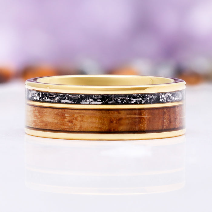 Side profile of the reclaimed oak and crushed meteorite inlays between polished yellow gold edges