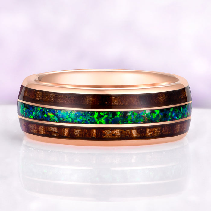 mens whiskey barrel wood ring with peacock fire opal on purple background
