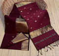 Deep wine red Maheshwari silk saree with small gold buti, a wide gold border and a kuchu-finished pallu, handwoven in Maheshwar