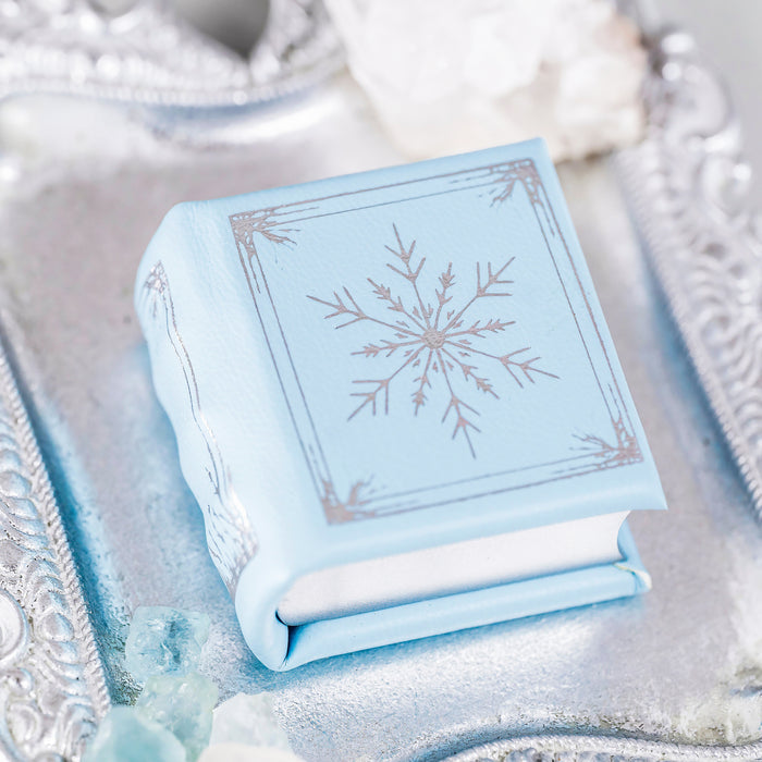 Winter Court Leather Book Ring Box – Glacier Mist Edition (Small) by Aquamarise, a handcrafted pale blue leather ring box with delicate snowflake design, ideal for meaningful jewelry gifts.