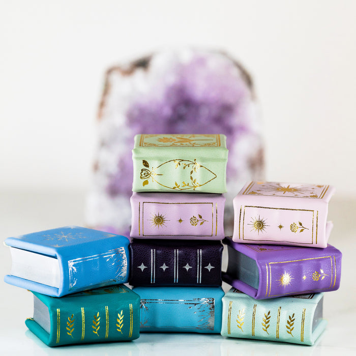 Summer Court Handmade Leather Book Ring Box- Seaglass Glow Edition (Small) by Aquamarise, stacked colorful leather ring boxes with gold detailing, fantasy-inspired keepsake proposals.