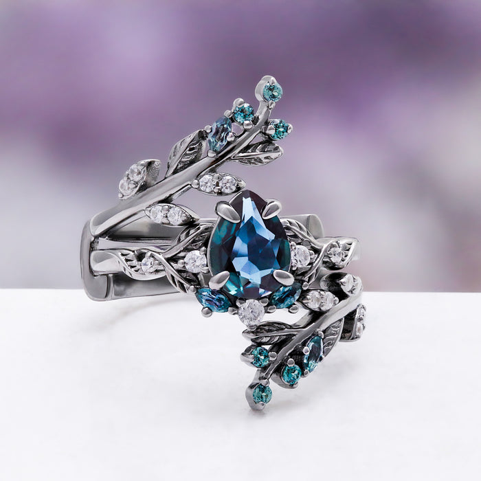 Wisteria alexandrite fairy leaf black ruthenium ring, side view