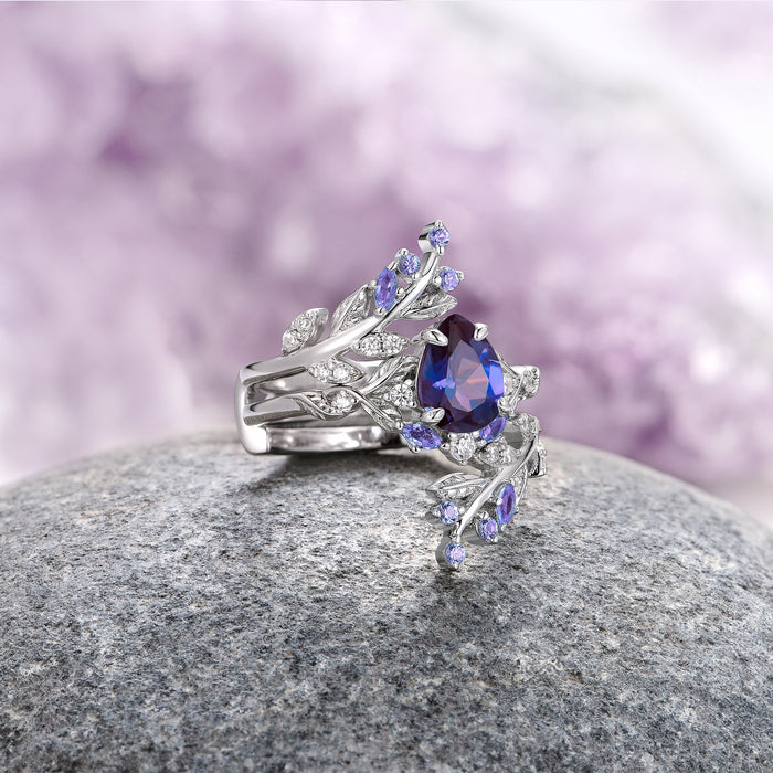 Wisteria Alexandrite Leaf Couples Ring Set by Aquamarise featuring a pear-shaped lab-grown alexandrite centerpiece with intricately crafted sterling silver leaf details and small accent stones, part of Matching Couples' Rings and June Birthstone Jewelry collections.