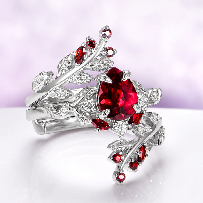 Wisteria Natural Red Garnet Leaf Couples Ring Set by Aquamarise, featuring sterling silver bands with natural red garnet gemstones and detailed leaf motifs for matching couples rings.