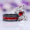 Wisteria Natural Red Garnet Leaf Couples Ring Set by Aquamarise, featuring a sterling silver ring with a heart-shaped red garnet surrounded by leaf motifs and a black band inlaid with crushed red garnets, part of Matching Couples' Rings and January Birthstone Jewelry collections.
